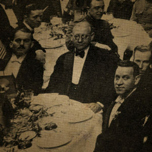 Men sitting together at a dinner table