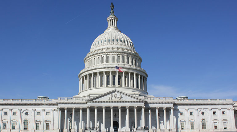 a white building with a flag on top